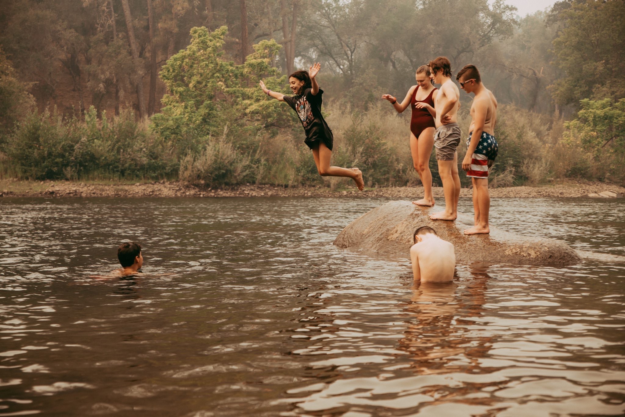 Academy Homepage Hero Shot Aubrey Jumping into the river.JPG